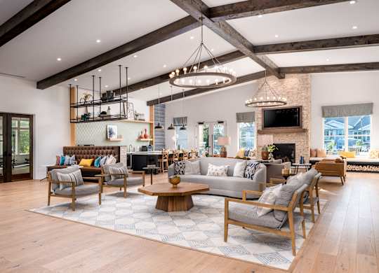 A modern living room with wooden floors and furniture.