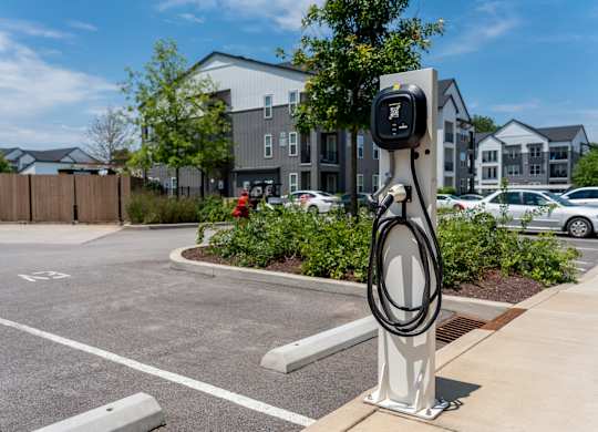 A charging station for electric vehicles is located in a parking lot.