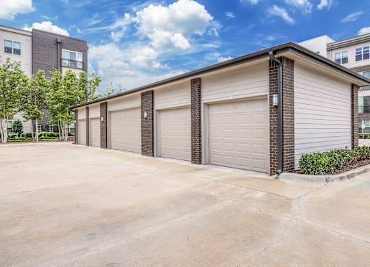 A two-car garage with a brick pillar in front.