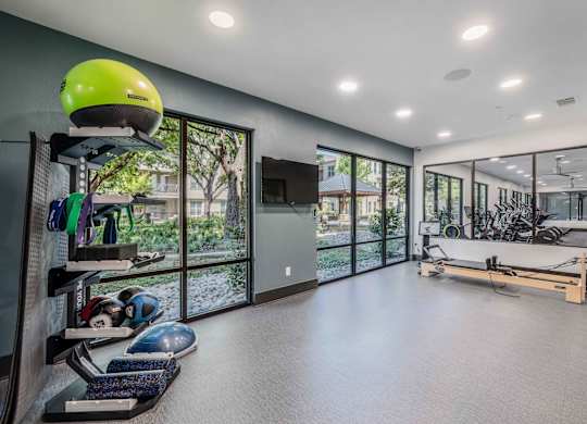 A room with a green helmet on a shelf and a bench in the background.