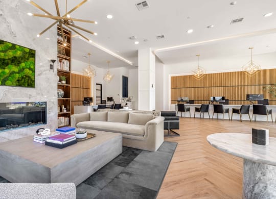 a living room with couches and a coffee table and a fireplace