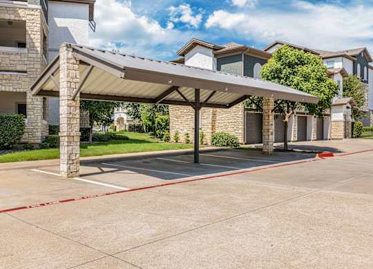 A covered walkway leads to a row of houses.