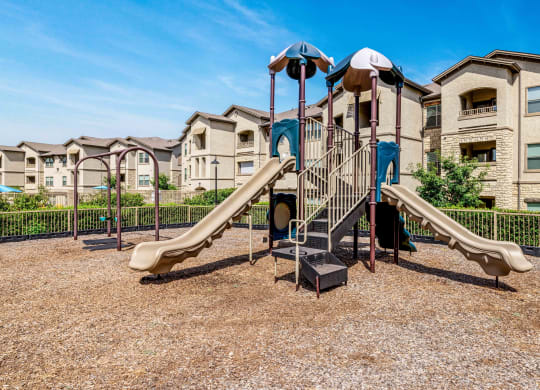 Playground with slides and two swings