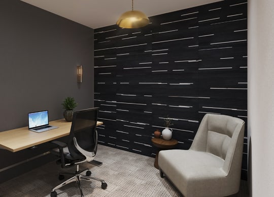 a home office with a laptop computer on a desk