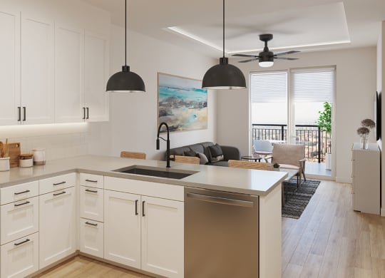 an open kitchen and living room with white cabinets and stainless steel appliances