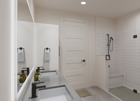 a white bathroom with a shower and a sink