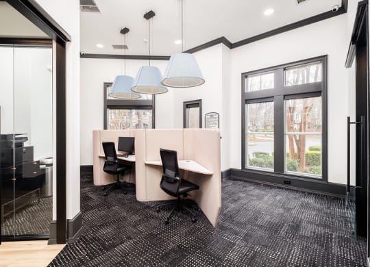 a conference room with a table and chairs and a large window