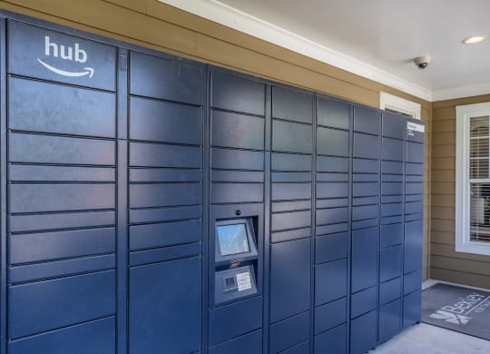 a row of package lockers in a shaded area