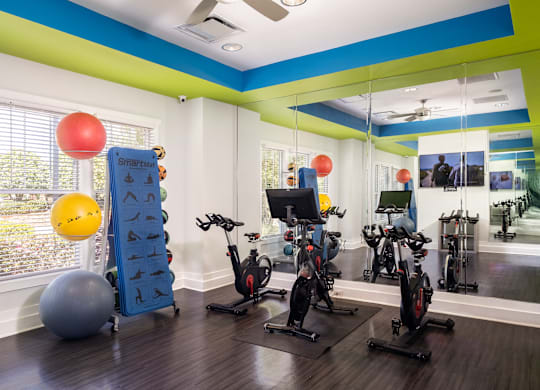 A room with exercise equipment and a window.