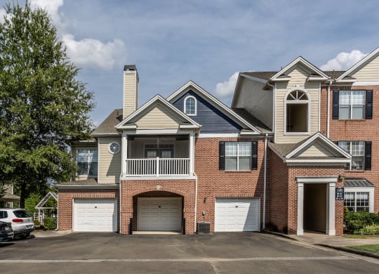 a house with two garages and a parking lot