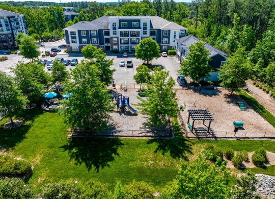 a birds eye view of legacy apartments and a park