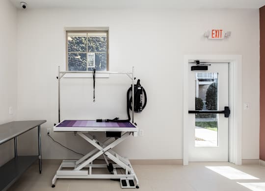 A room with a table and a window.