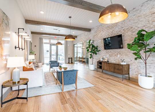 a living room filled with furniture and a flat screen tv