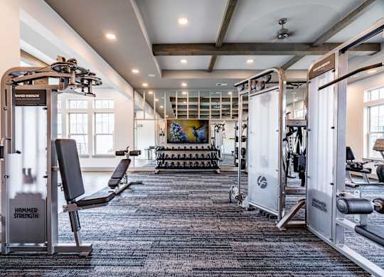 the gym at the enclave at woodbridge apartments in sugar land, tx