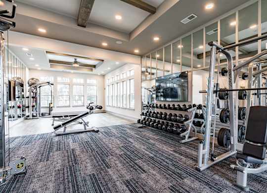 the gym at the enclave at woodbridge apartments in sugar land, tx