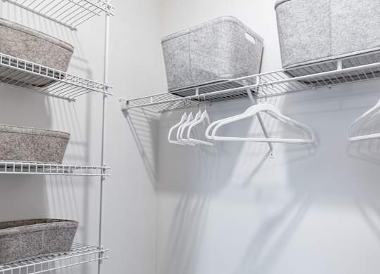 a walk in closet in a 555 waverly unit