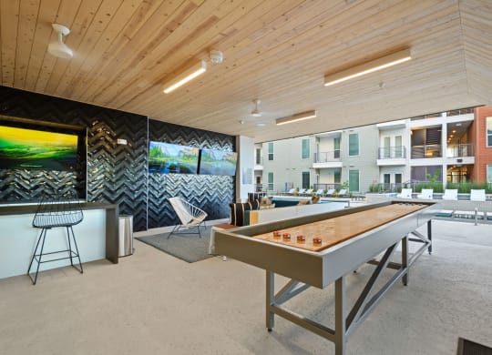 Covered Poolside Sports Lounge with TVs and Shuffleboard