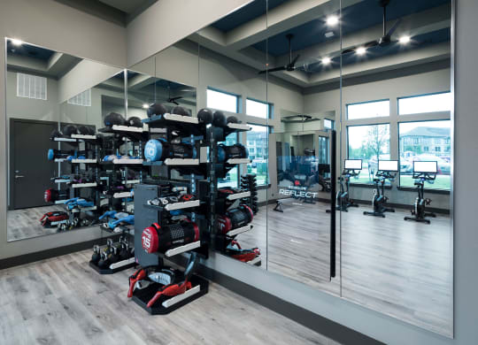 a row of red and black motorcycles in a mirrored room