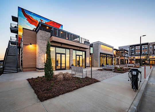 a view of a building with a mural on the side of it