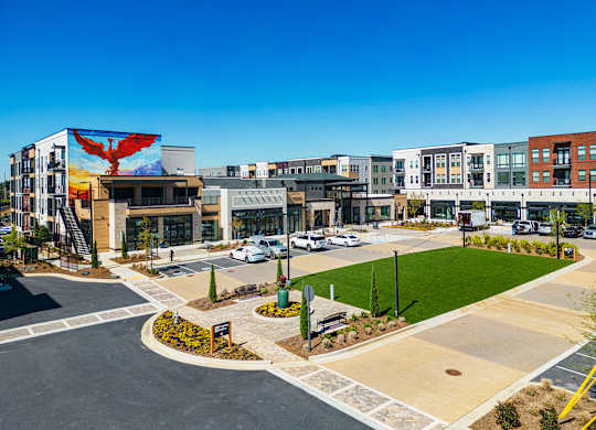 an aerial view of a building with a large mural on the side of it