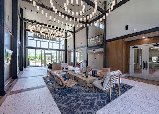 a view of the lobby atrium at the preserve at great pond apartments in windsor