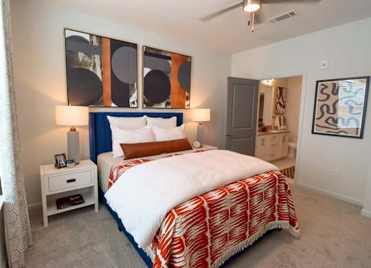 a bedroom with a large bed and a large window