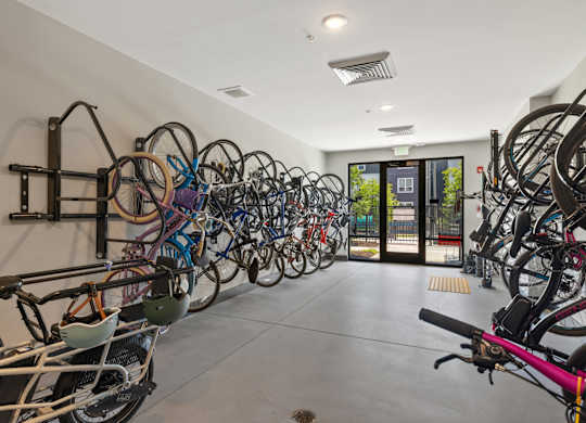 A bike rack with many bikes parked.