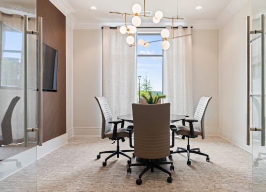 a conference room with a table and chairs