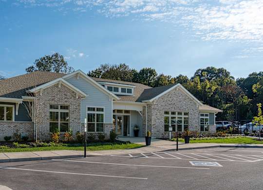 A building with a parking lot in front of it.