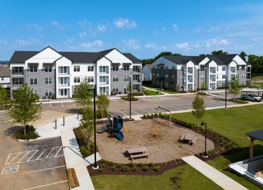 an aerial view of an outdoor playground at an apartment complex