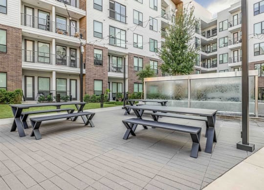our apartments have a large patio with picnic tables and a water fountain