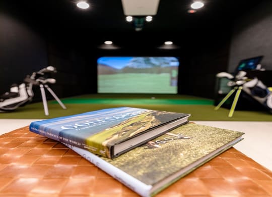 a book sitting on top of a table in front of a video game