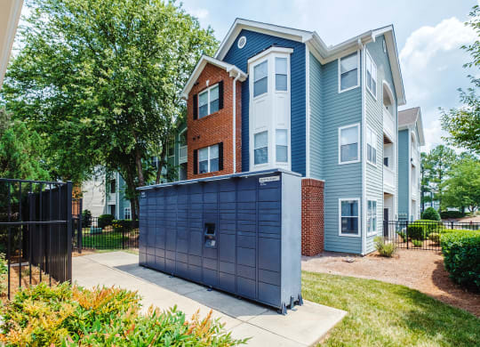 a blue and brick apartment building with a blue garage door
