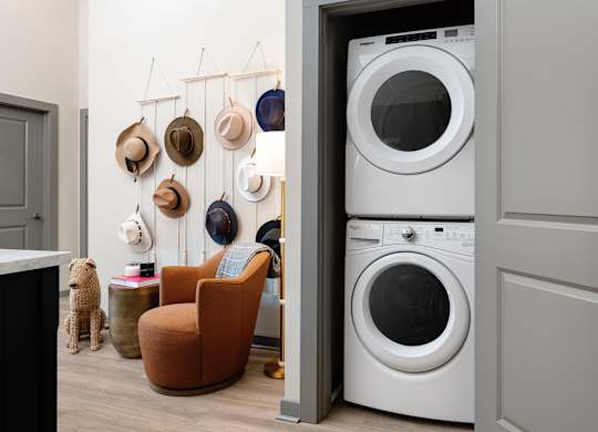 A white washing machine is in a doorway.