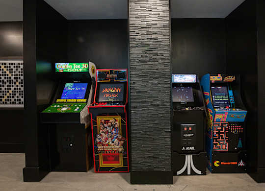 a group of arcade games in a room