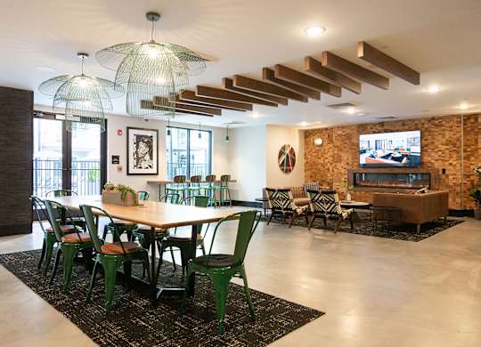 a dining room with a table and chairs and a television