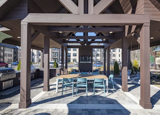 a large covered patio with tables and chairs