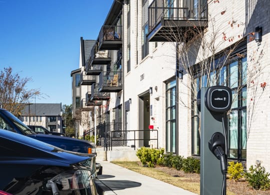 a car is plugged in to a electric charger