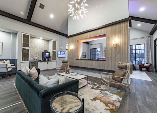 a living room with couches and chairs and a large mirror