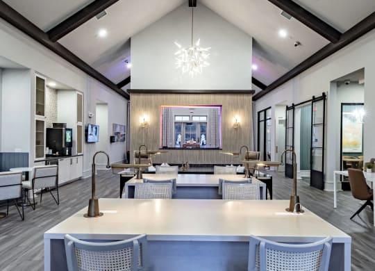 a dining room with tables and chairs and a lounge area with a fireplace