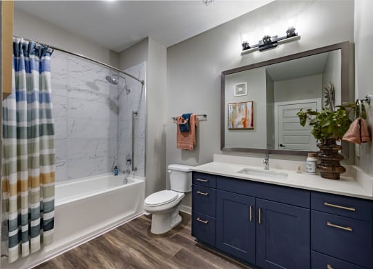the residence on lamar apartment bathroom with shower sink and toilet