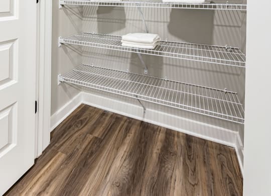 the closet in the master bedroom is closable and organized with wire shelves