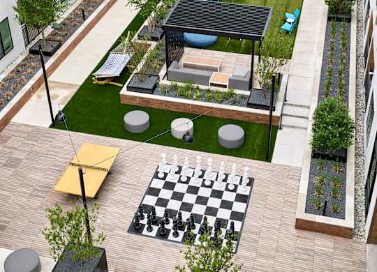A rooftop patio with a chess board and a black and white checkerboard.