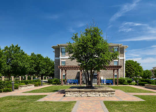 A large building with a tree in front of it.