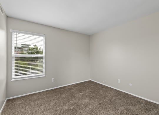 Bedroom with gray walls and a window with a blind at Creve Coeur, Creve Coeur, MO