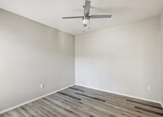 A room with a ceiling fan at Sweetwater At Metro North Apartments, Arizona 85029