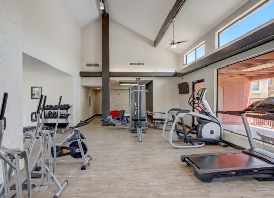 Gym with cardio equipment and weights at the Glen at Mesa Apartments, Mesa, Arizona 85201