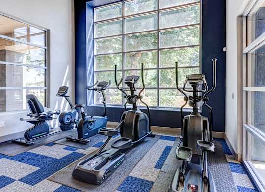 A room with a row of exercise bikes at Sweetwater At Metro North Apartments, Phoenix, AZ 85029