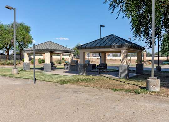 A gazebo-like structure sits in the middle of a park-like setting at Sweetwater At Metro North Apartments, Phoenix, Arizona