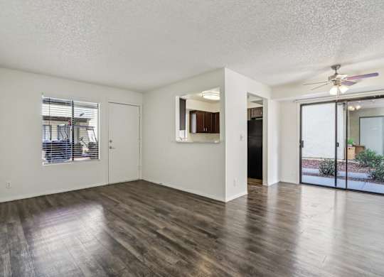 A room with wooden floors and white walls.
